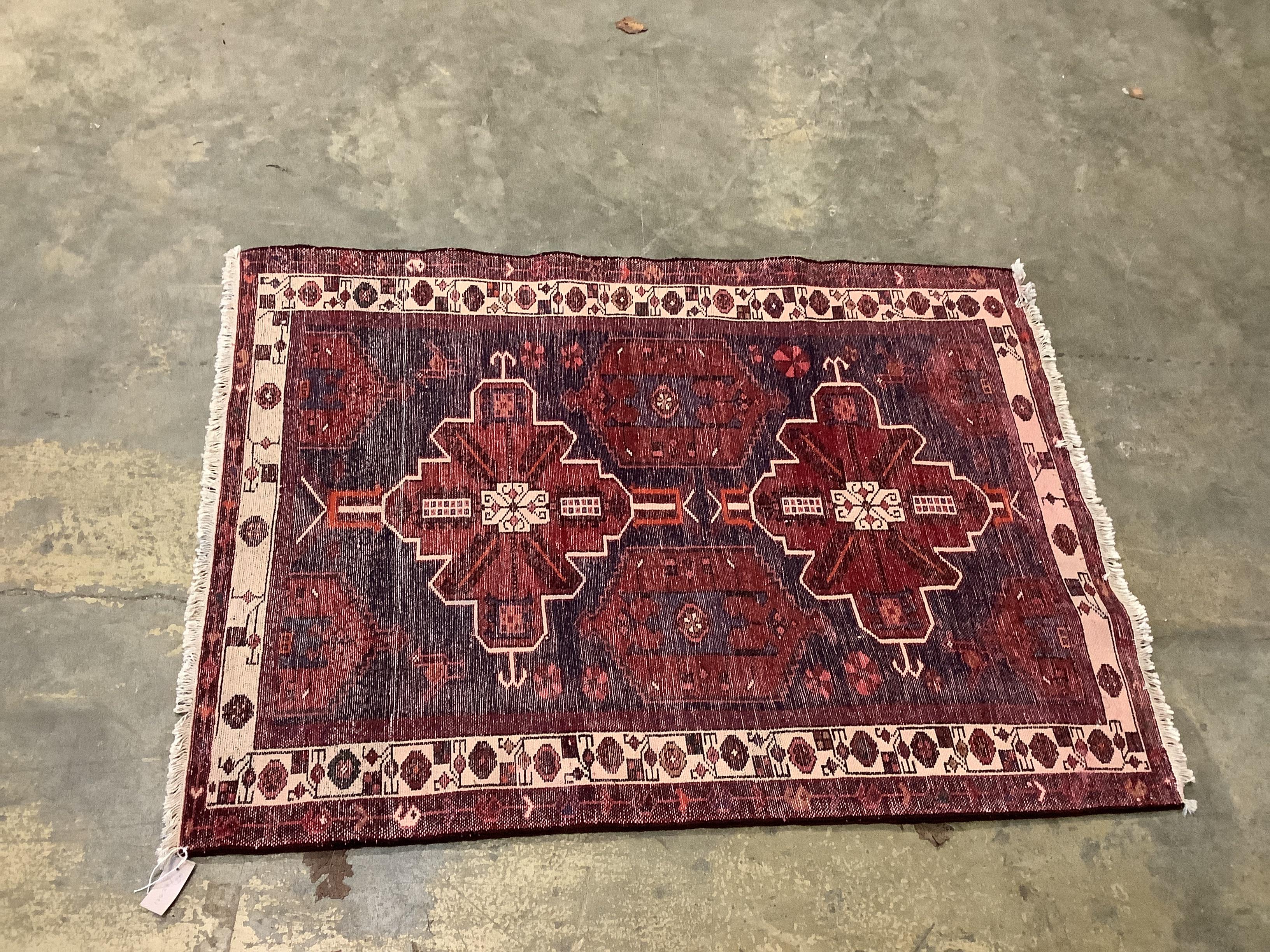 A Turkish blue ground rug, 144 x 102cm